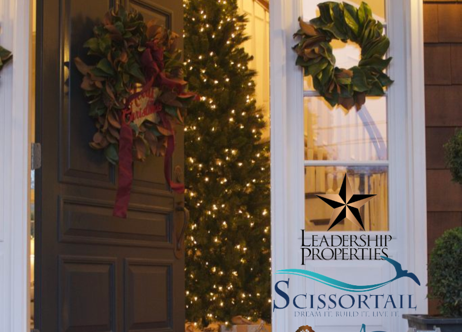 Front door decorated with a Christmas wreath, glowing holiday lights, and Leadership Properties logo, symbolizing festive home ambiance and community living in Northwest Arkansas.
